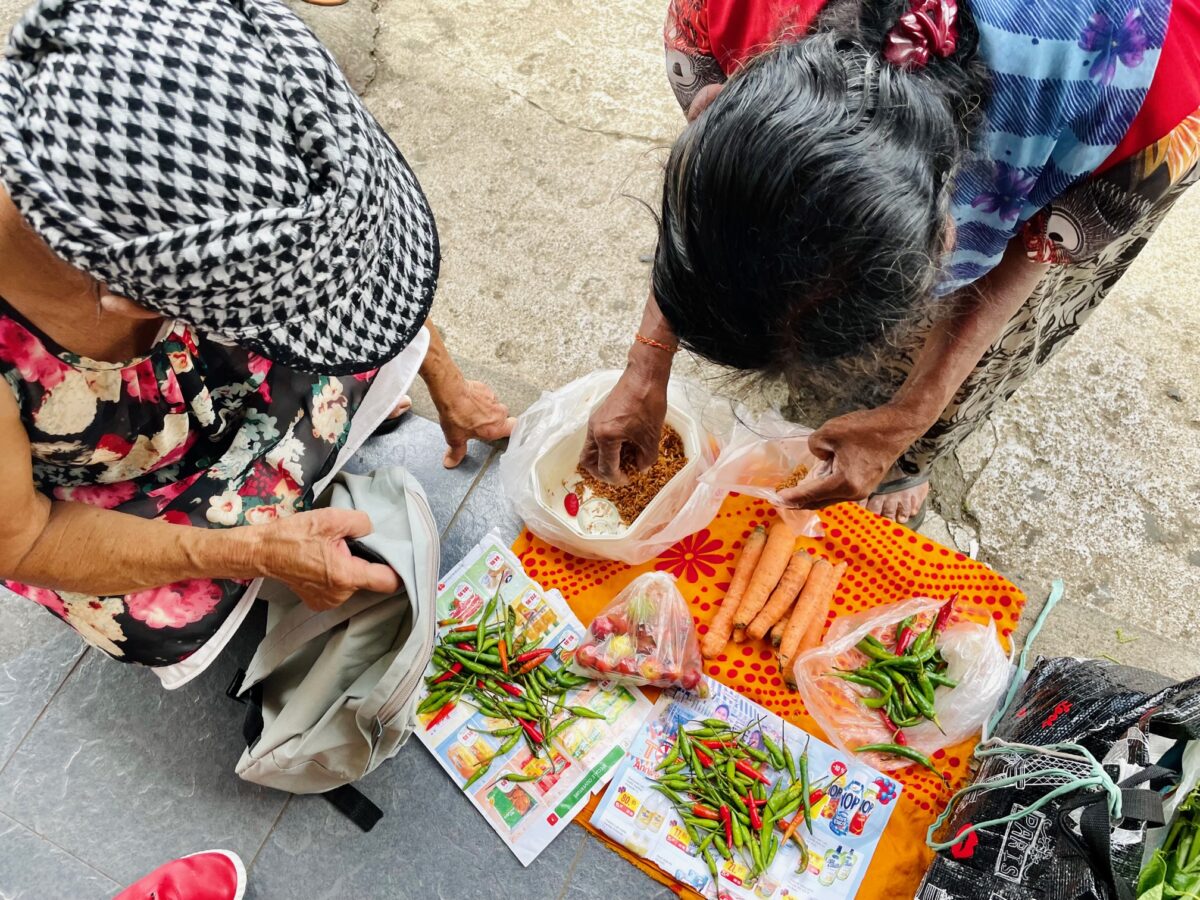 Street vendor selling Mauritian small wild river shrimp