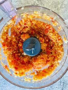 Blended garlic and red chili pepper paste in small food processor.