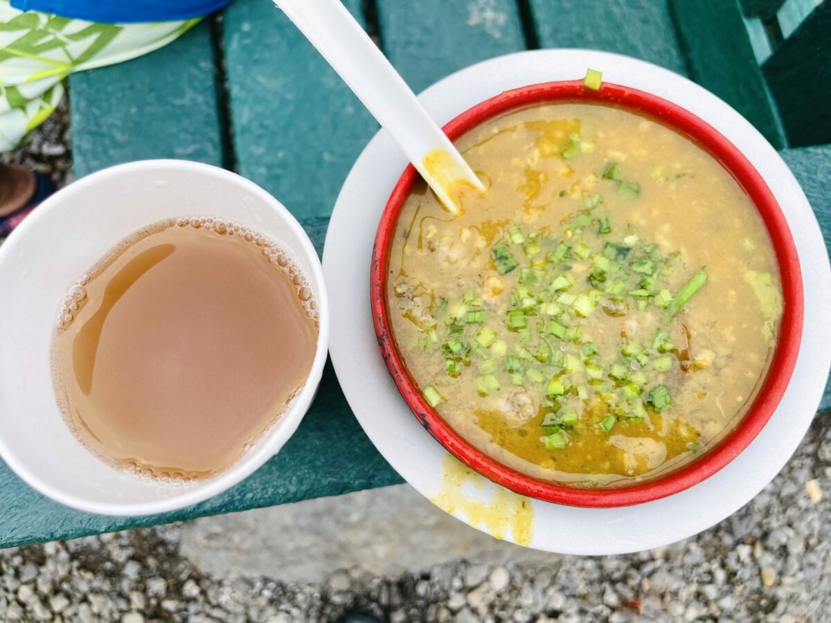 Mutton halim bowl with side of vinegar in bowls, in bazaar Mahebourg.