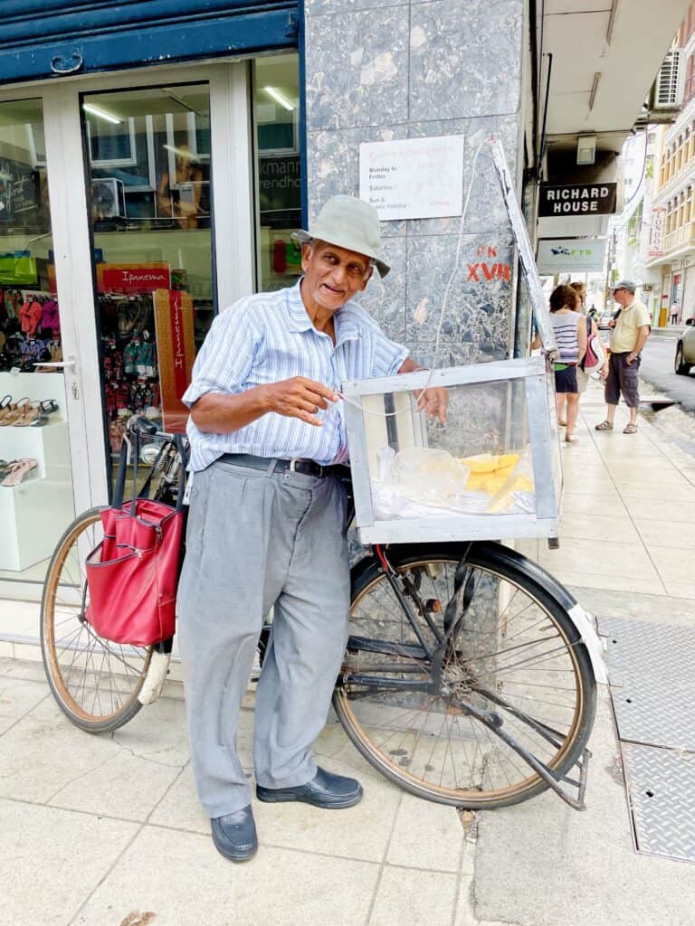 Monsieur Ajam - Corn pudding street vendor in Port Louis.