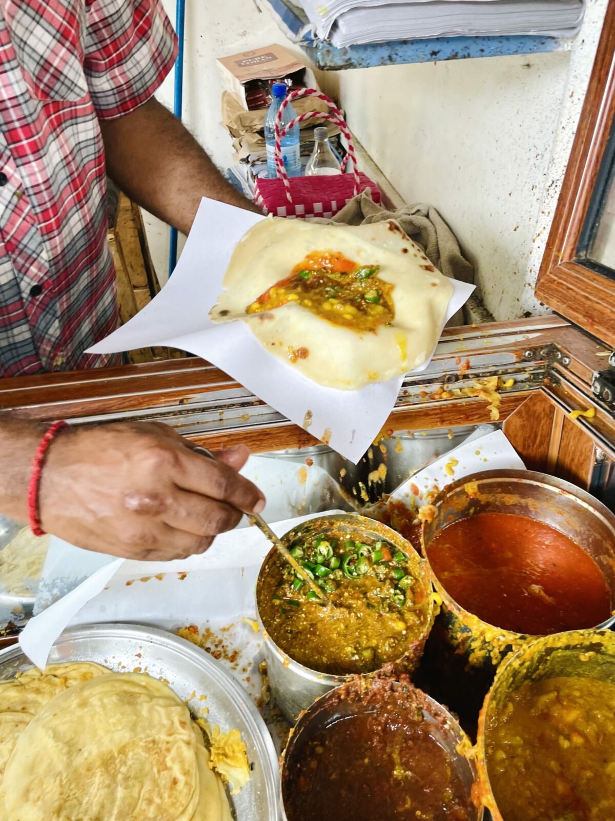 Mauritian Roti with vegetarian fillings - Mr. Shyam Bhugoo street vendor in Mahebourg.