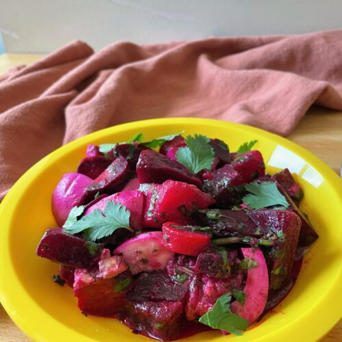 Simple Beet and Potato Salad in a yellow plastic plate
