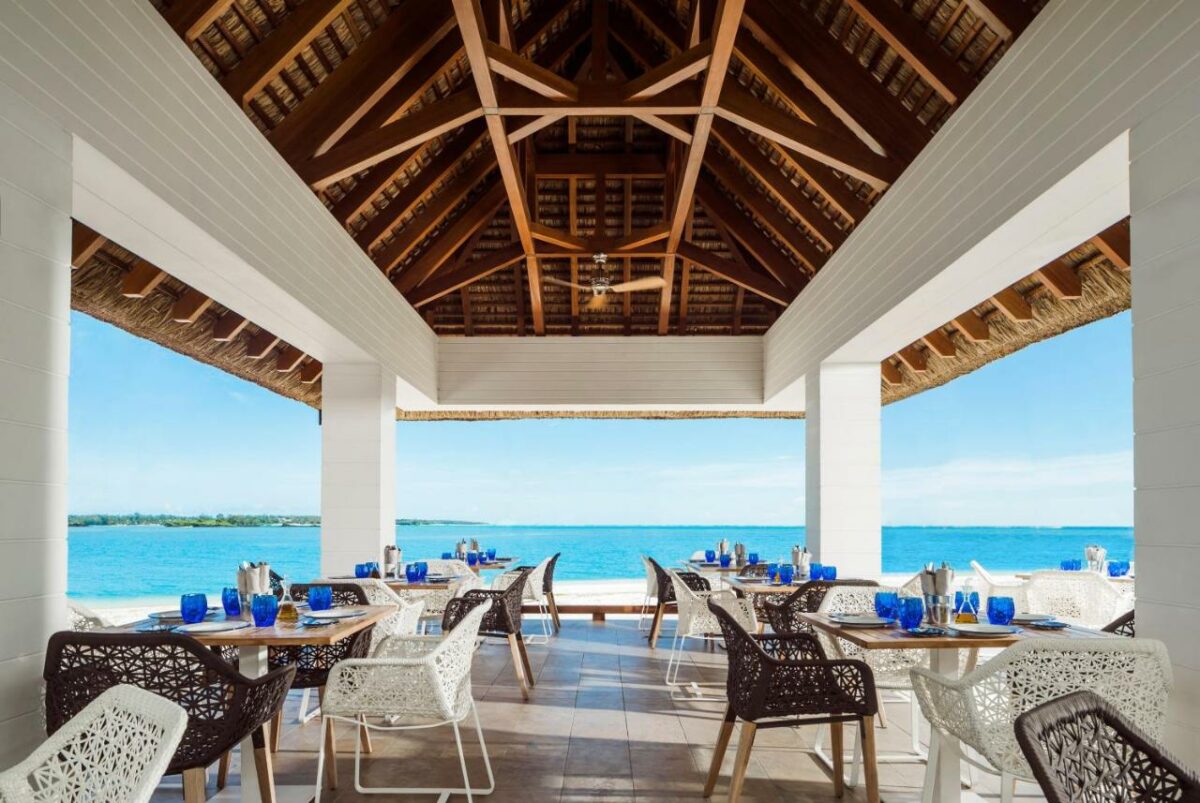 One&Only Le Saint Geran. Restaurant overlooking the ocean.